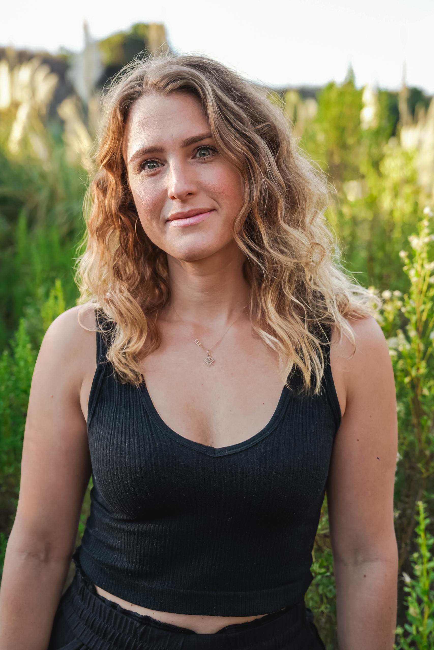 Emily Beliveau smiling in nature